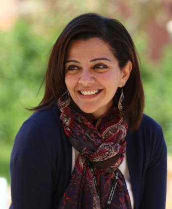 Lady wearing a scarf smiling