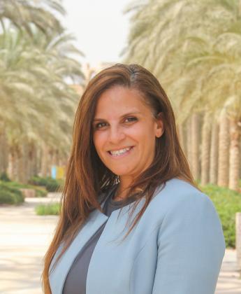 A woman with a blue blazer jacket