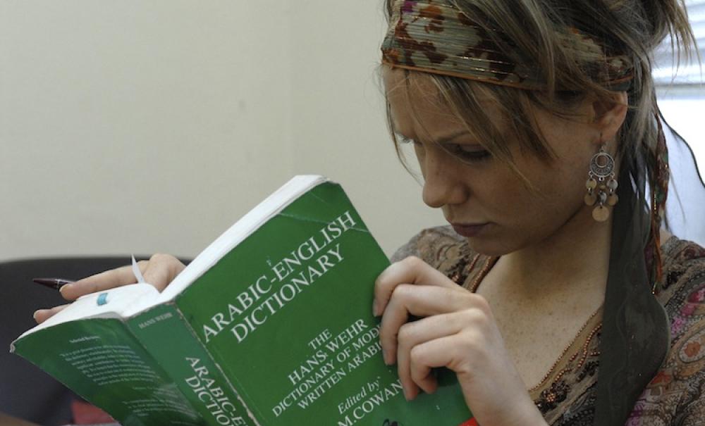 AUC student reading a book